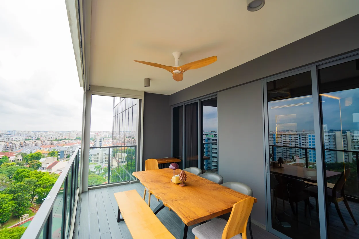 Balcony with dining table and wooden ceiling fan