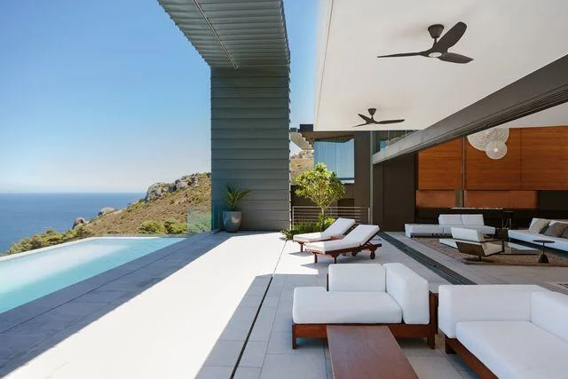 Modern villa with pool and fan Villa with infinity pool, ocean view, and ceiling fan