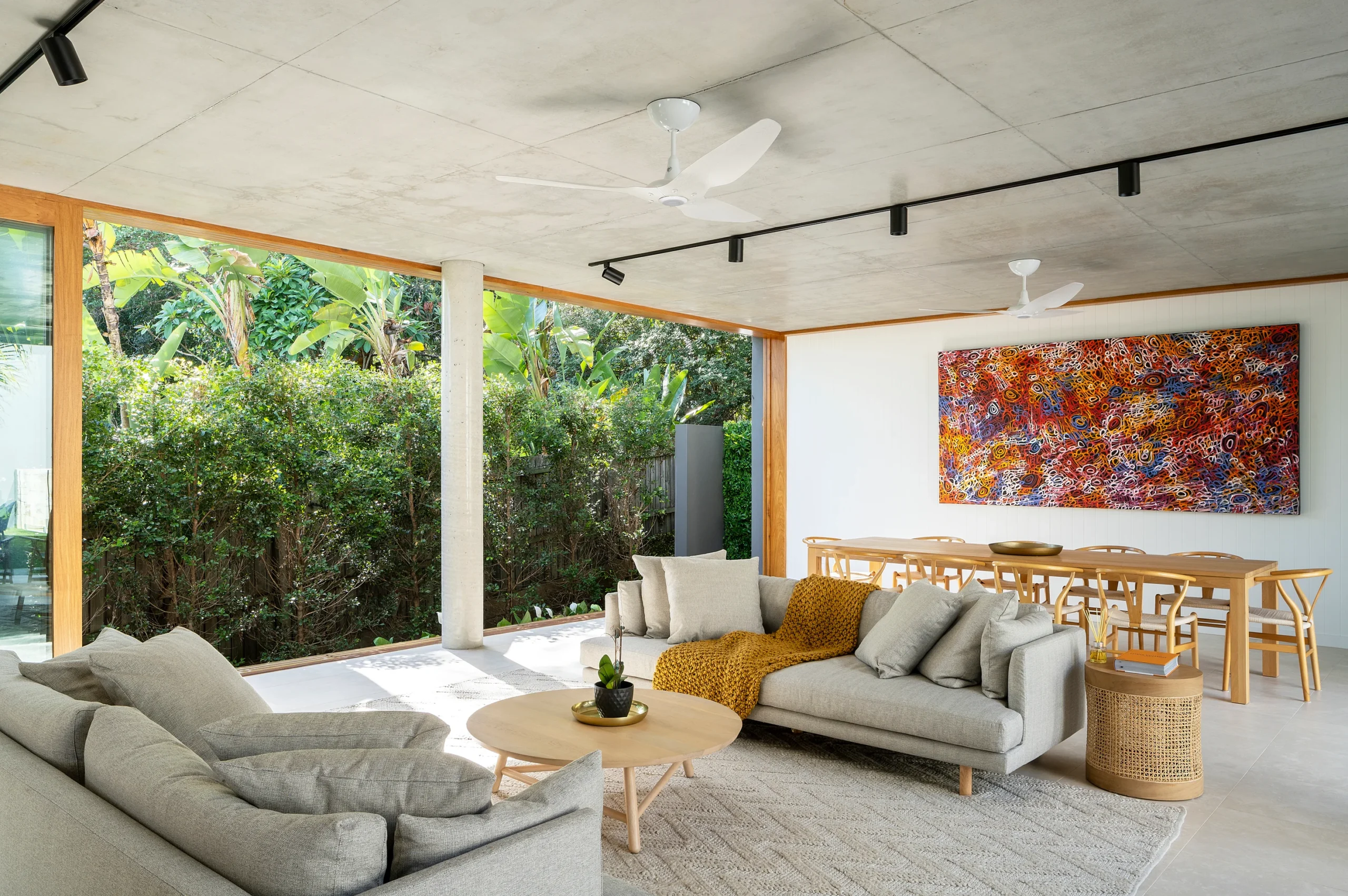 Patio with ceiling fans and dining area
