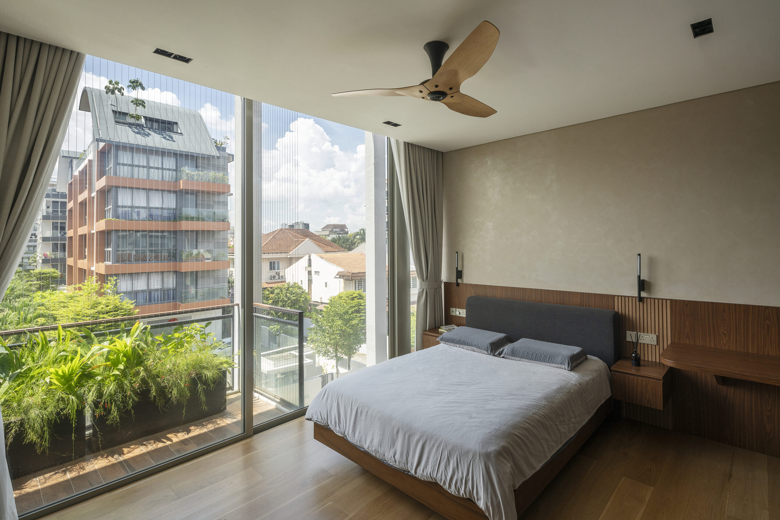 Caramel-colored Haiku fan in the bedroom